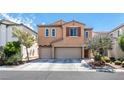 Two-story home featuring a neutral exterior, attached garage, and well-maintained landscaping at 9856 Chief Sky St, Las Vegas, NV 89178