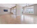 Spacious living room featuring tile floors, recessed lighting, and window shutters at 10901 Fort Valley Ave, Las Vegas, NV 89134