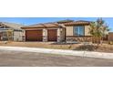 Beautiful single-story home with a two-car garage and a nicely landscaped front yard at 1220 Eva Creek Dr # 35, North Las Vegas, NV 89084