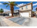 Charming two-story home features a two-car garage, desert landscaping, and long driveway at 1360 Angel Falls St, Las Vegas, NV 89142