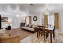 Comfortable living room with sofa, dining table and chairs, neutral colors, and bright natural light at 1414 S 13Th St, Las Vegas, NV 89104