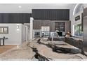 Sleek kitchen with a large waterfall island, stainless steel appliances, and custom cabinetry at 2268 Buckingham Ct, Henderson, NV 89074