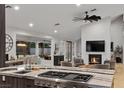 Modern kitchen featuring stainless steel appliances, stone countertops, and an open view to the backyard at 2268 Buckingham Ct, Henderson, NV 89074