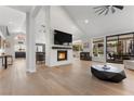 Open living area with fireplace, large screen television, recessed lighting, and access to the backyard at 2268 Buckingham Ct, Henderson, NV 89074