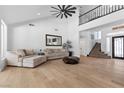 Inviting living room featuring high ceilings, hardwood floors and staircase leading to a second floor at 2268 Buckingham Ct, Henderson, NV 89074