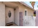 Inviting front entrance with security features and a charming welcome mat at 25 Colbath St, Las Vegas, NV 89110