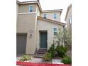 Charming two-story townhome with well-maintained landscaping and inviting entrance at 2761 Frosted Teal Ave, North Las Vegas, NV 89086