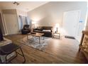 Inviting living room with a modern sofa, plush rug, and neutral color palette at 2840 China Cove St, Laughlin, NV 89029