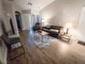 Comfortable living room with wood flooring, a cozy rug, and plenty of natural light at 2840 China Cove St, Laughlin, NV 89029