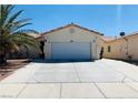 Charming single-story home with a well-maintained front yard and a wide driveway at 3301 W Colton Ave, North Las Vegas, NV 89032