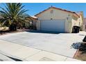 Exterior view of home showcasing well maintained driveway and simple landscaping at 3301 W Colton Ave, North Las Vegas, NV 89032