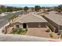 Charming single-Gathering home with brick driveway, mature landscaping, and a spacious three-car garage at 3706 Etendre Ct, Las Vegas, NV 89121