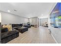 Spacious living room with wood-style flooring and modern recessed lighting at 3854 Stadium Ave, Las Vegas, NV 89120
