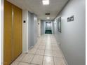 Hallway featuring neutral walls, tiled floor, and unit number sign at 3930 University Center Dr # 603, Las Vegas, NV 89119