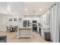Charming kitchen featuring stainless steel appliances, granite countertops, and a cozy breakfast nook at 6525 Raven Hall St, North Las Vegas, NV 89084