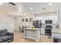 Charming kitchen featuring stainless steel appliances and granite countertops at 6525 Raven Hall St, North Las Vegas, NV 89084
