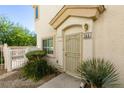 Close-up of the home's entrance with a decorative security door and manicured landscaping at 6549 Clara Bow Ave # 103, Las Vegas, NV 89122