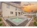Inviting backyard featuring a pool, jacuzzi, covered patio, barbecue, and desert landscaping at 7466 Matilda St, Las Vegas, NV 89113