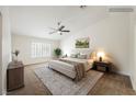 Calm primary bedroom features a ceiling fan, neutral carpet, and plantation shutters at 7754 Pink Ginger St, Las Vegas, NV 89123