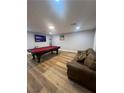 Large living room features a pool table, comfortable seating, and recessed lighting at 8095 Carpenter Creek Ave, Las Vegas, NV 89113