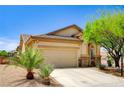 Charming single-story home featuring a two-car garage and desert landscaping at 9137 Big Plantation Ave, Las Vegas, NV 89143