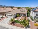 Charming single-story home with desert landscaping, and a two-car garage at 9282 W Viking Rd, Las Vegas, NV 89147