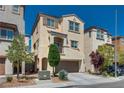Inviting two-story home with desert landscaping and private balcony off the main suite at 10519 Mann St, Las Vegas, NV 89141