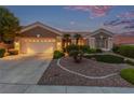 Inviting home showcasing a wide driveway and well-kept landscaping enhancing its curb appeal at 10832 Heritage Hills Dr, Las Vegas, NV 89134
