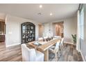 Elegant dining room with wood floors and modern table set, perfect for gatherings at 1213 Dre Harbor Pl # Lot 83, North Las Vegas, NV 89084