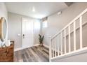 Welcoming foyer featuring wood floors, staircase, and stylish decor for a modern look at 1213 Dre Harbor Pl # Lot 83, North Las Vegas, NV 89084