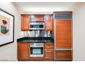 Sleek kitchen with stainless steel appliances, including built-in oven and microwave at 135 Harmon Ave # 3220, Las Vegas, NV 89109
