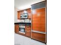 Modern kitchen features stainless steel appliances and custom wood cabinetry at 135 Harmon Ave # 3220, Las Vegas, NV 89109