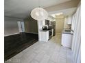 Updated kitchen with stainless steel appliances and stylish lighting and flooring at 1405 Vegas Valley Dr # 380, Las Vegas, NV 89169