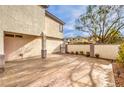 Spacious backyard featuring a stamped concrete patio and privacy wall at 170 Wicked Wedge Way, Las Vegas, NV 89148