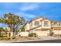 Charming two-story home with a two-car garage and desert landscaping at 170 Wicked Wedge Way, Las Vegas, NV 89148