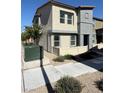 Modern two-story home featuring neutral-tone stucco, trimmed windows, and xeriscaping at 1906 Arietta Vista St, Henderson, NV 89044
