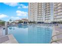 Beautiful sparkling pool with lounge chairs and shade at 200 W Sahara Ave # 603, Las Vegas, NV 89102