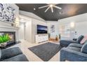 Bright living room featuring a fireplace, recessed lighting, plush seating, and a stylish gray accent wall at 3145 Tarpon Dr, Las Vegas, NV 89120