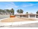 Charming single-story home with a two car garage and low maintenance desert landscaping at 4270 Wendy Ln, Las Vegas, NV 89115