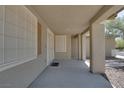 Spacious and covered front porch featuring decorative security screen door with lots of natural light at 5912 Kit Cove Ct, Las Vegas, NV 89131