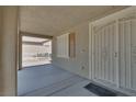 View of a cozy and enclosed front porch and decorative security screen door offering privacy and curb appeal at 5912 Kit Cove Ct, Las Vegas, NV 89131
