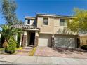 Lovely two-story home features a tile roof, stone accents, and a three-car garage at 640 House Blend Ln, Henderson, NV 89052