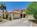 Spacious two-story home with desert landscaping, a tile roof, and a driveway leading to the attached two-car garage at 6409 Sea Swallow St, North Las Vegas, NV 89084