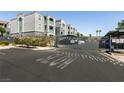 Gated parking area with clearly marked spaces for residents and guests at 6955 N Durango Dr # 2081, Las Vegas, NV 89149