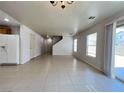 Large open-concept space with tile flooring, recessed lighting and a backyard view at 7249 Old Glory St, Las Vegas, NV 89148
