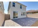 A spacious, private backyard area with stone pavers, perfect for outdoor entertaining and relaxation at 7256 Saxby Ave, Las Vegas, NV 89113