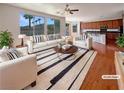 Bright living room with modern furnishings and a neutral color palette offering a cozy space at 9319 Bronze River Ave, Las Vegas, NV 89149