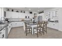 Bright kitchen boasts a large center island, stainless steel appliances, and sleek countertops at 10729 Marathon Bell Ln, Las Vegas, NV 89129
