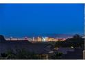 Stunning Las Vegas Strip views from this home, highlighting the city's vibrant nightscape and distant mountains at 10729 Marathon Bell Ln, Las Vegas, NV 89129
