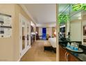 Hotel suite featuring a full wet bar, comfortable seating area, and an open bedroom area at 125 E Harmon Ave # 717, Las Vegas, NV 89109